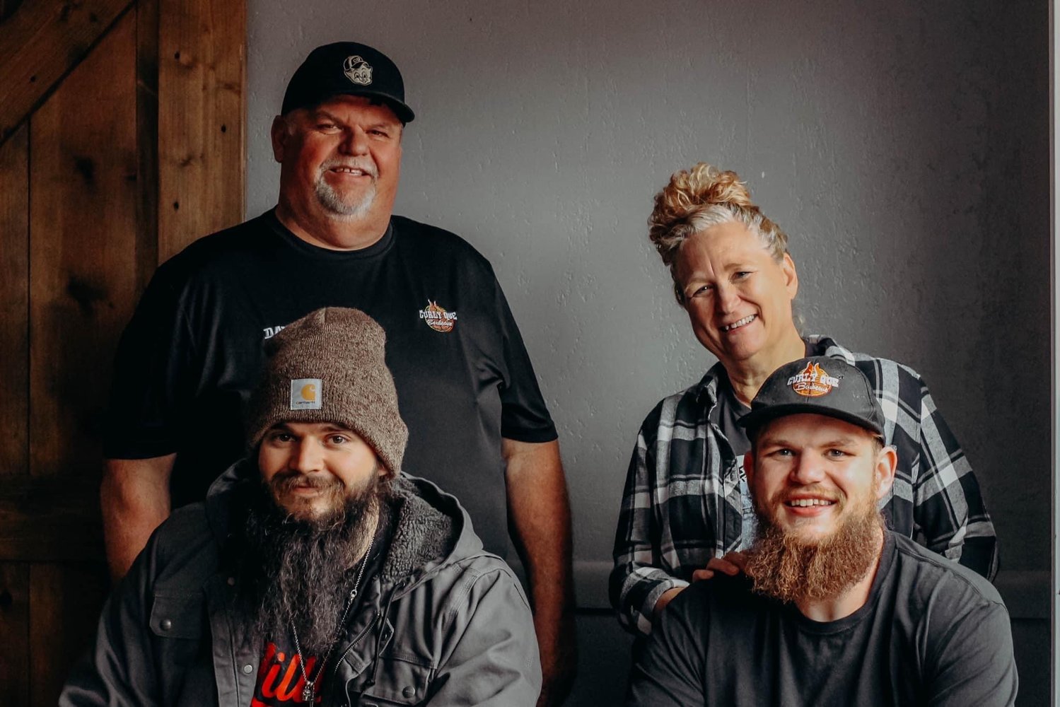 Bolivar-based Curly Que Barbecue, led by David and Cindi Lockhart, back row, their son, Jake Lockhart, bottom right, and his friend Jacob Mills, plans to expand to Springfield next month.